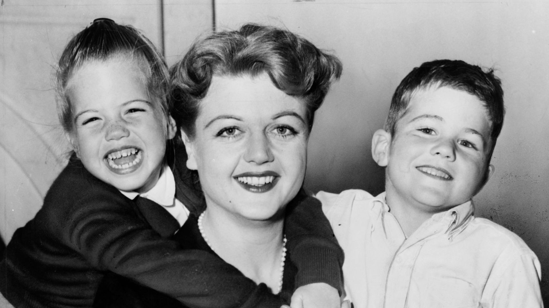 Angela Lansbury, three-quarter length portrait, seated with daughter Deidre and son Anthony / World Telegram & Sun photo by Roger Higgins.