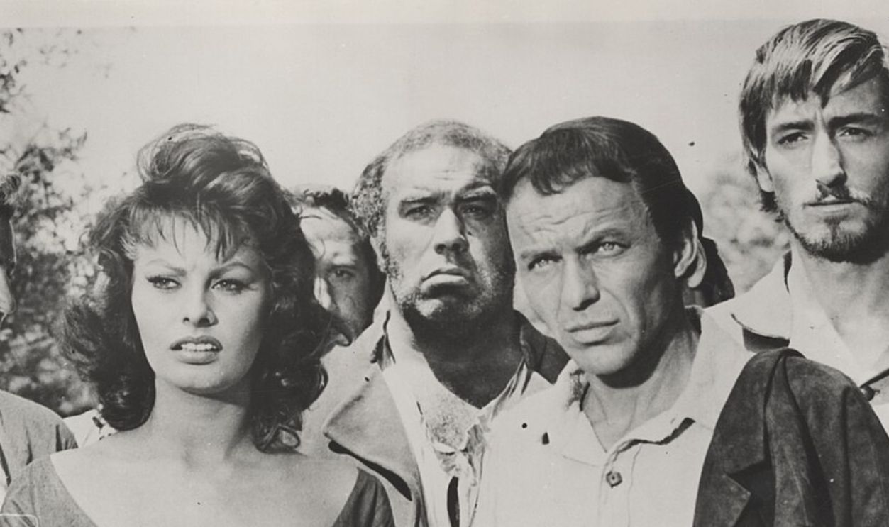 Sophia Loren, Frank Sinatra and others actors in a scene from The Pride and the Passion, a film directed and produced by Stanley Kramer in 1957.