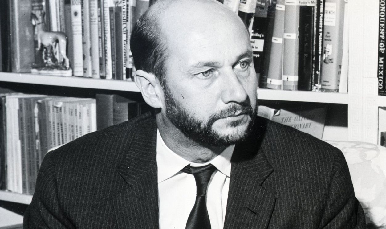Donald Pleasance sits looking neat and dapper in a suit and tie, a contrast to his dirty, disheveled appearance when he plays the part of The Caretaker in Harold Pinter's play, The Caretaker Isn't Really playing at the Lyceum Theater. New York City, New York.