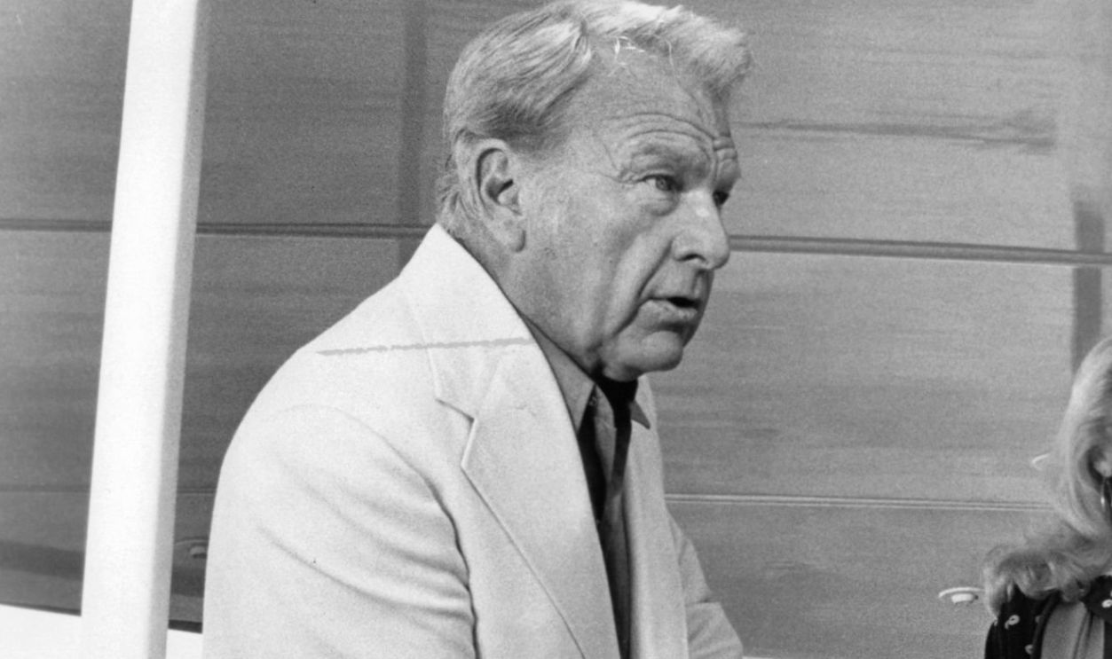 Eddie Albert muses about old times with long time friend Catherine Deneuve in a scene from the film 'Hustle', 1975. 