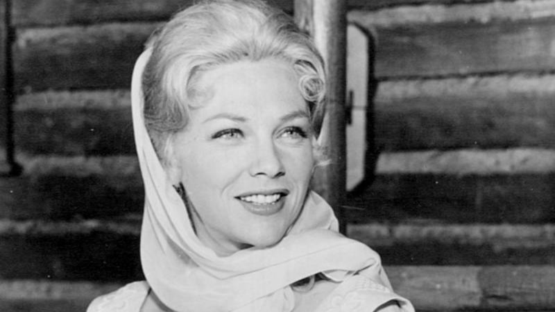 Joanna Moore wearing white scarf