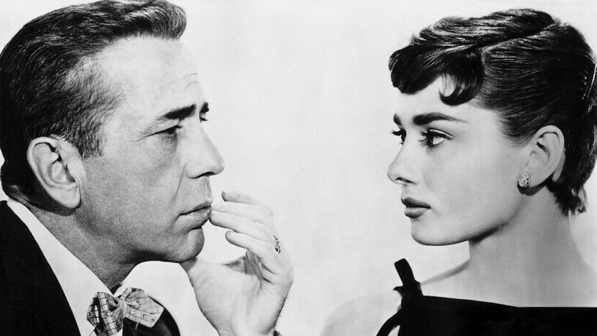 Humphrey Bogart & Audrey Hepburn in American romantic comedy-drama film Sabrina (1954).