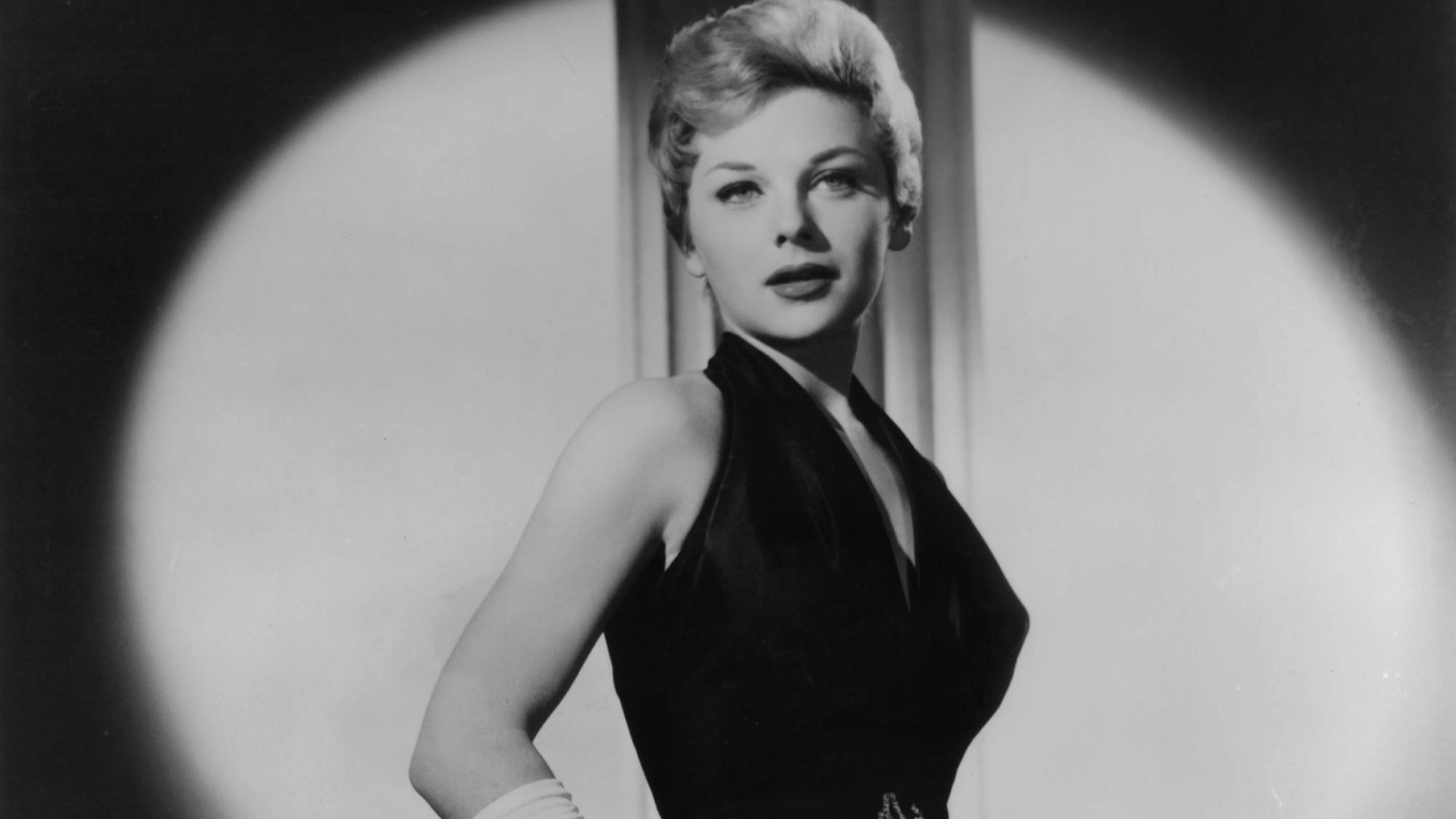 Joanna Moore in black dress