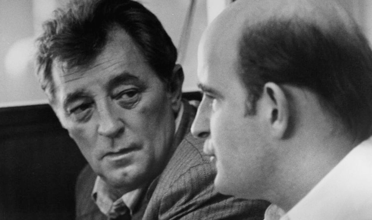 Peter Boyle and Robert Mitchum discuss an illegal deal in a scene from the film 'The Friends Of Eddie Coyle', 1973. 