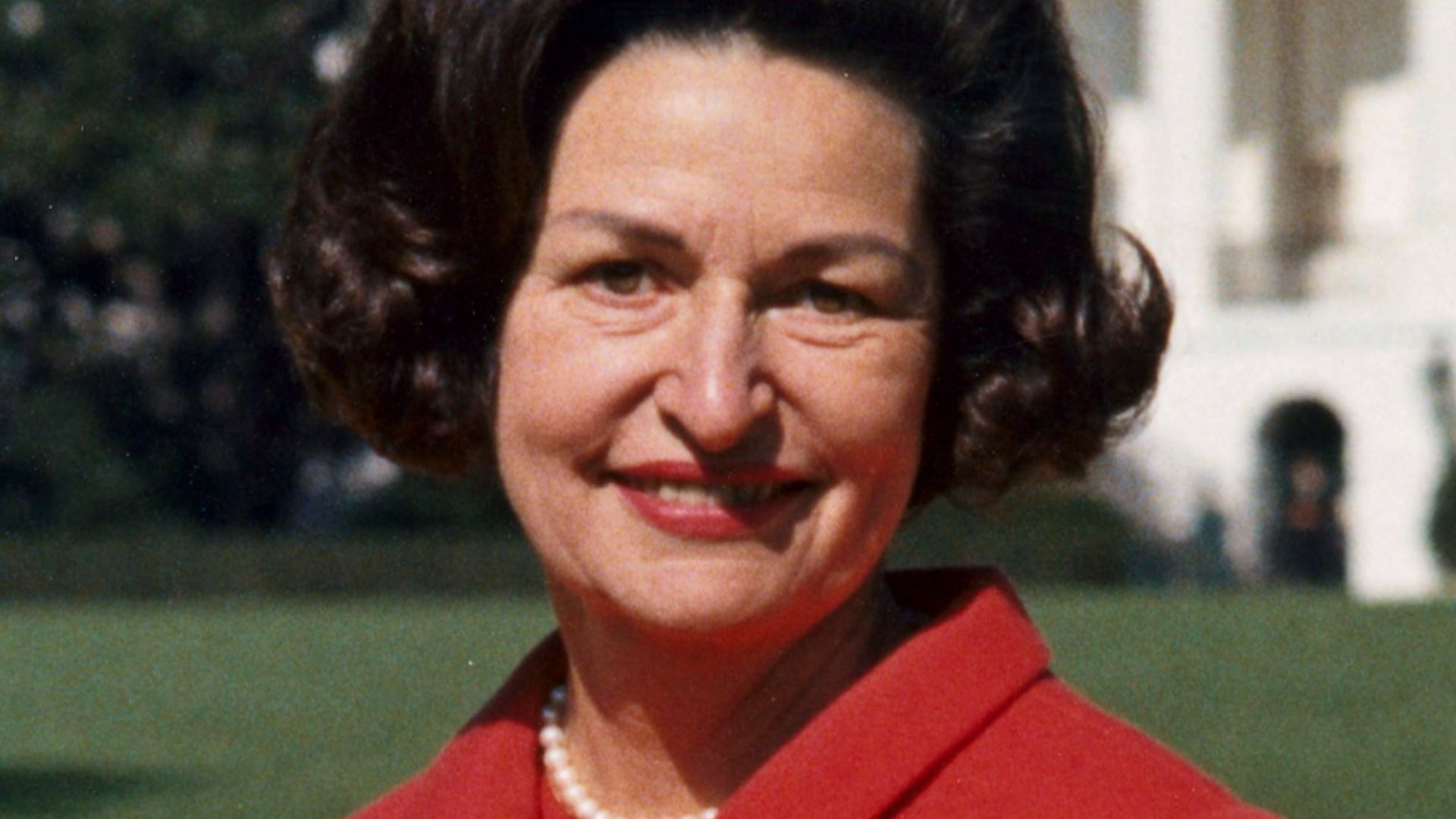 Photo portrait of First Lady Lady Bird Johnson in the back yard of the White House, cropped to use in article