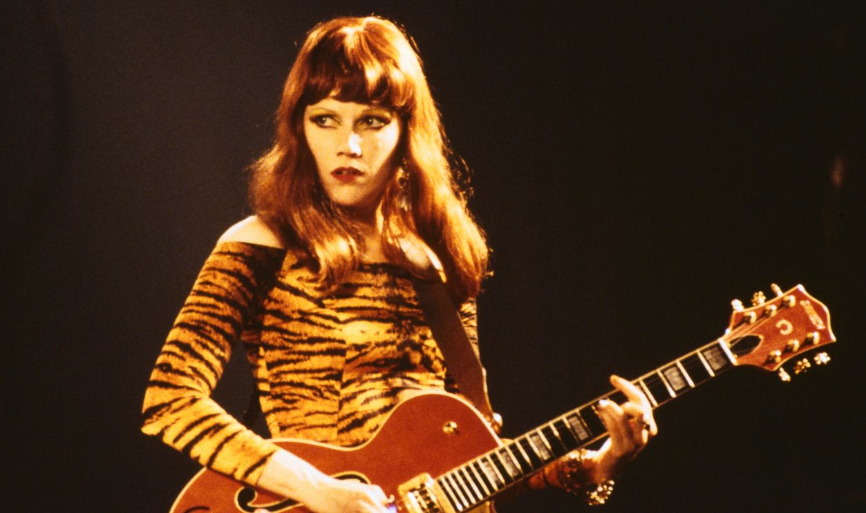 American guitarist Poison Ivy (Kristy Marlana Wallace) performing on stage with American rock band The Cramps, circa 1992