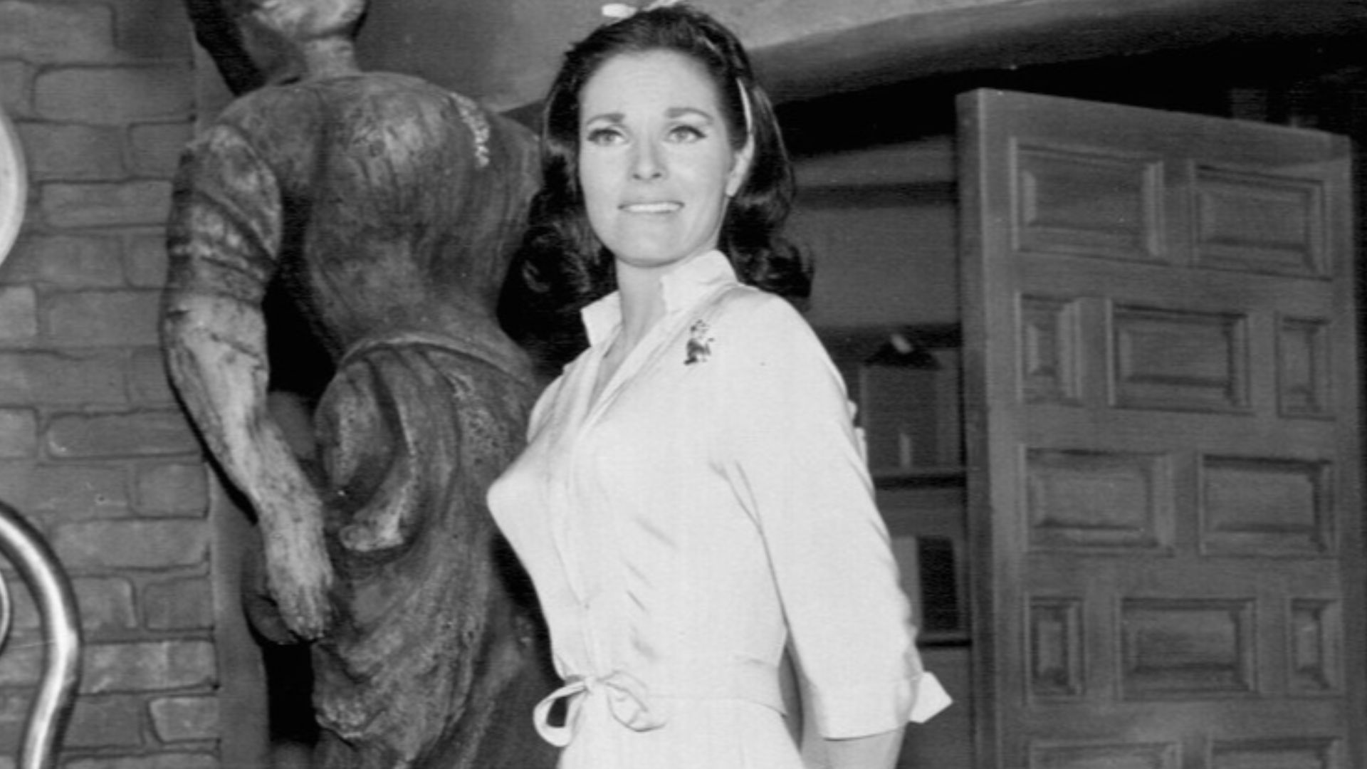 Photo from Batman (1966 film). Lee Meriwether as Catwoman, in the guise as Miss Kitka, wins the heart of Batman. (Julie Newmar originated the role in the TV series, but had other commitments when the feature film was cast.)