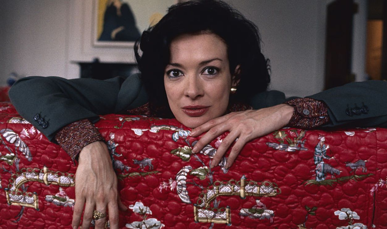 Actress Dixie Carter Leaning over Couch