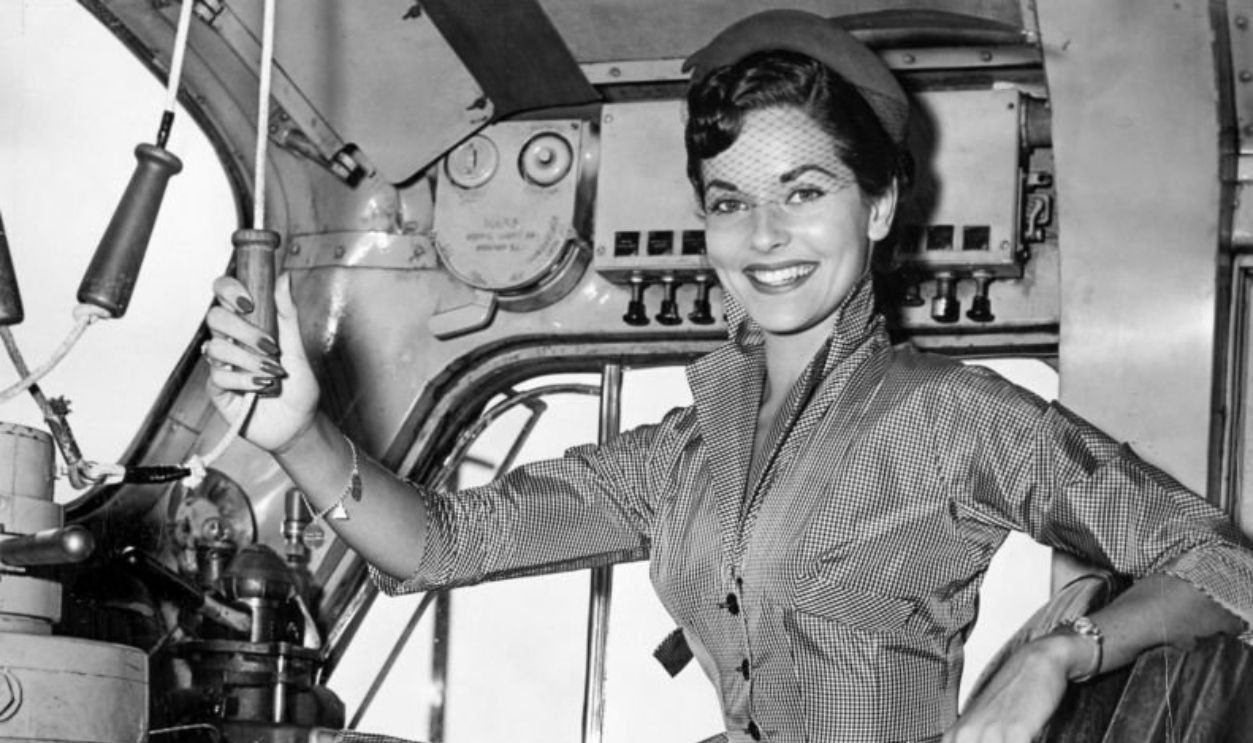 OAKLAND, CALIFORNIA - SEPTEMBER 3: Miss California Lee Ann Meriwether, 19, tests the cab of the locomotive bound for Atlantic City where she will compete for Miss America at the train depot in Oakland on September 3, 1954.