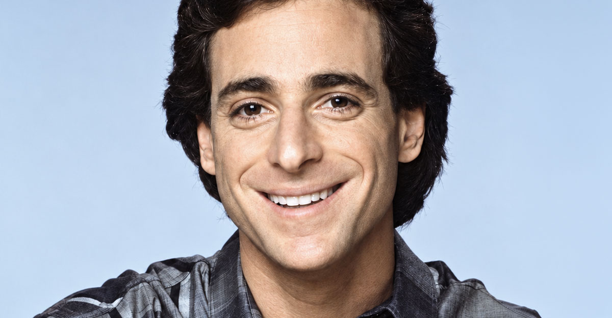 Bob Saget wearing a grey plaid shirt