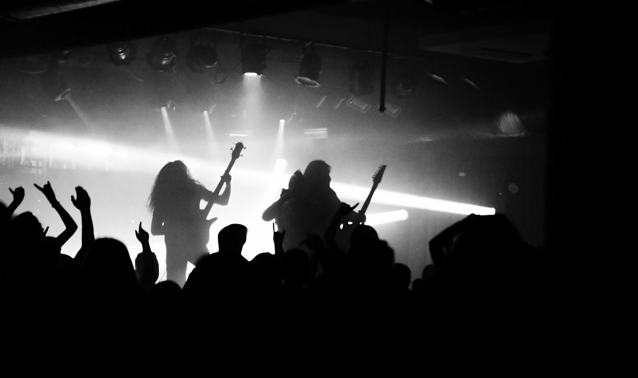 Captivating silhouette of a rock band performing live with an energetic crowd