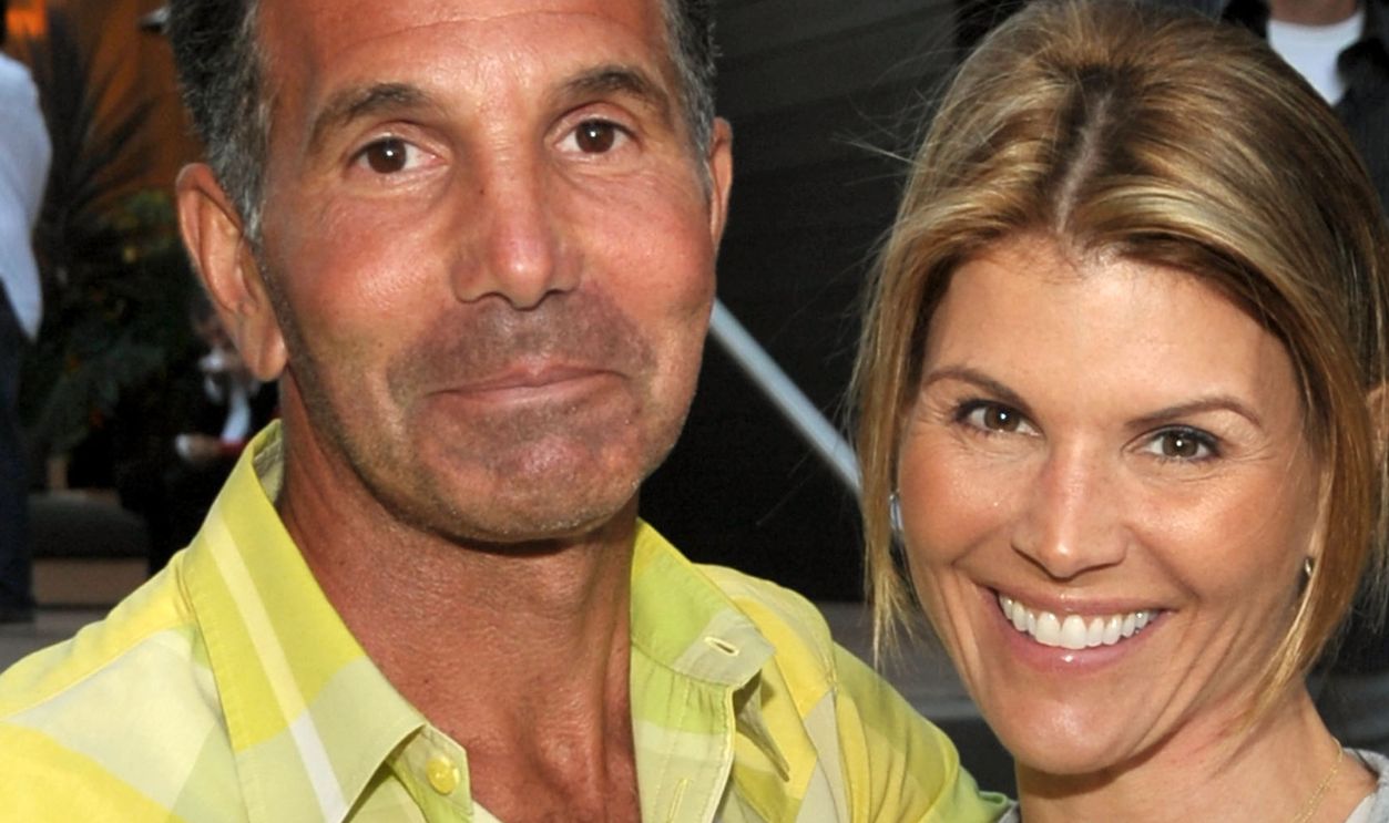 MALIBU, CA - APRIL 21: Designer Mossimo Giannulli and actress Lori Loughlin attend the Malibu Lumber Yard grand opening held at the Malibu Lumber Yard on April 21, 2009 in Malibu, California.