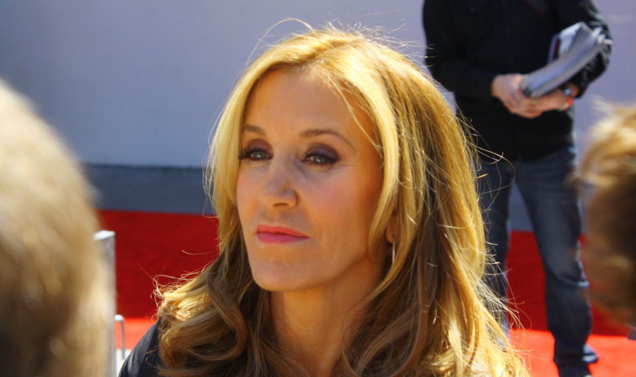 HOLLYWOOD - MARCH 7, 2012: Desperate Housewife Felicity Huffman chats with fans at Walk of Fame ceremony where she and husband William H. Macy receive stars on March 7, 2012 inHollywood, CA.