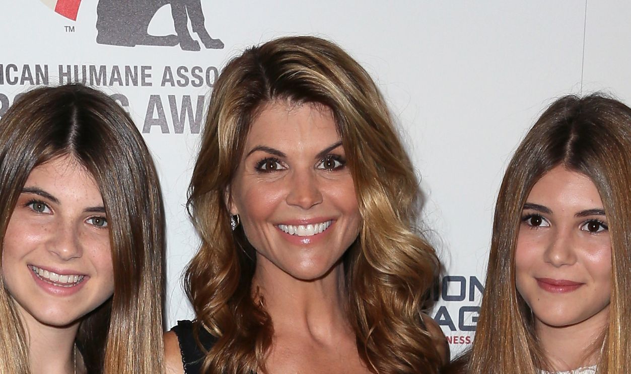 BEVERLY HILLS, CA - SEPTEMBER 27: Actress Lori Loughlin (C) and daughters Isabella Rose Giannull and Olivia Jade Giannull attend the 4th Annual American Humane Association Hero Dog Awards at The Beverly Hilton Hotel on September 27, 2014 in Beverly Hills, California.