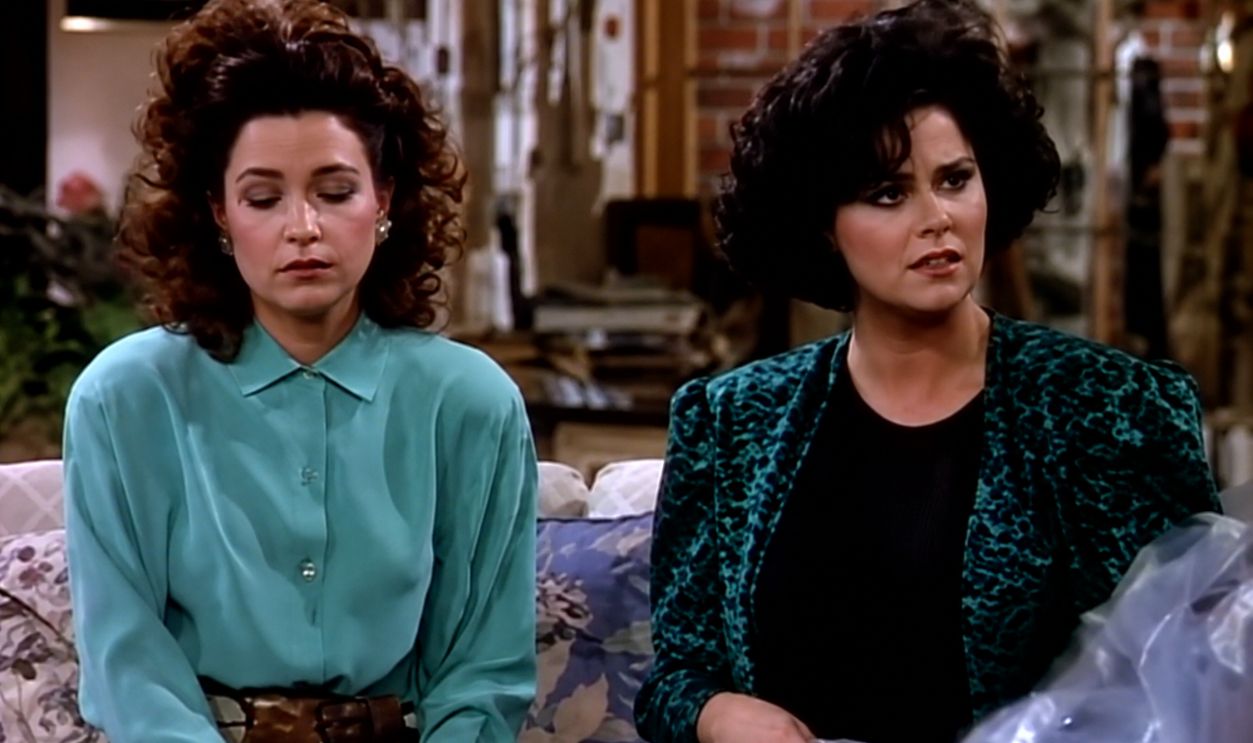 Delta Burke waving