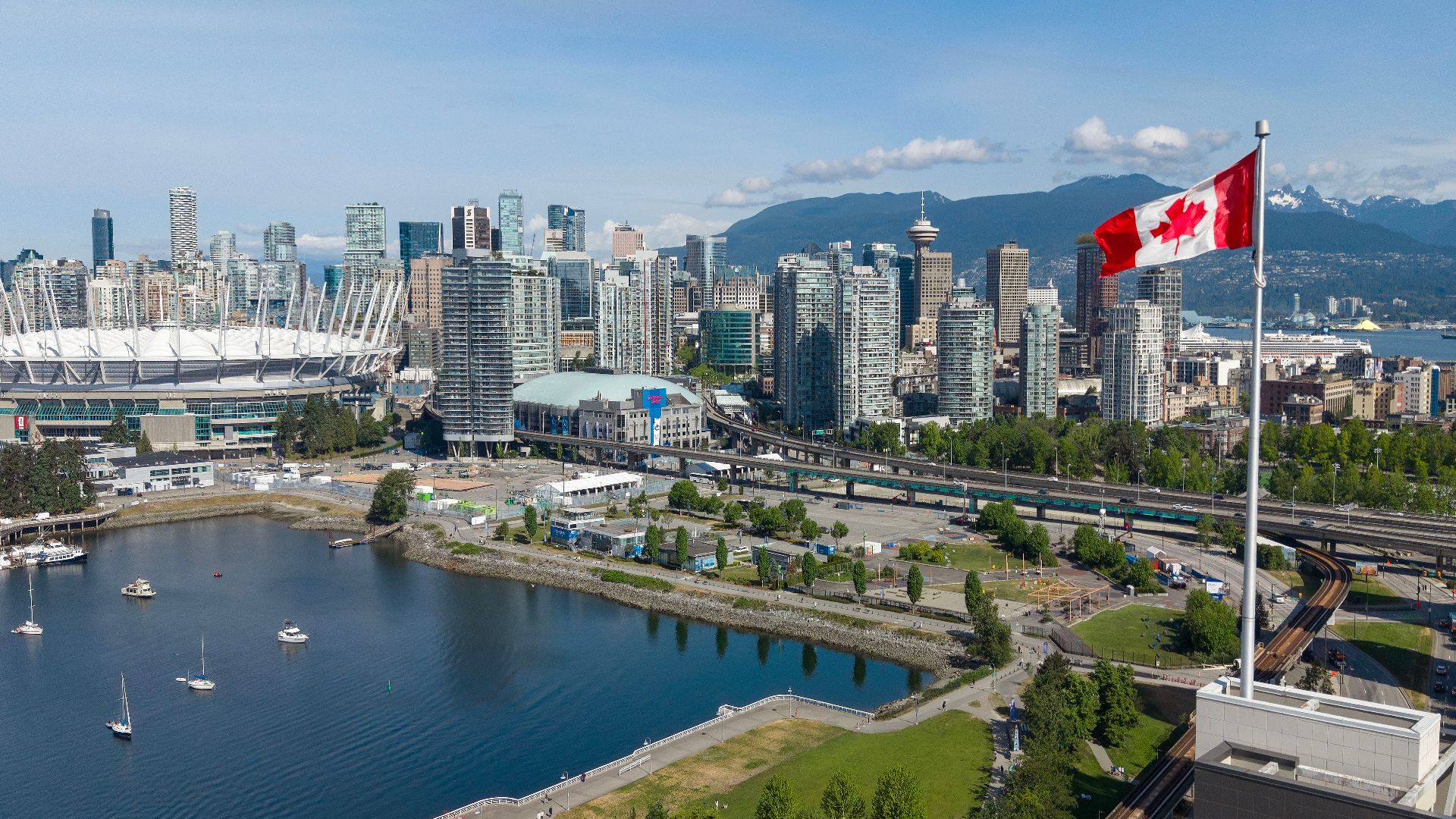 Skyline view of downtown Vancouver, British Columbia, Canada’s third-largest metropolitan area and a major Pacific port city shaped by Asian immigration, mountain geography, and dense urban development.