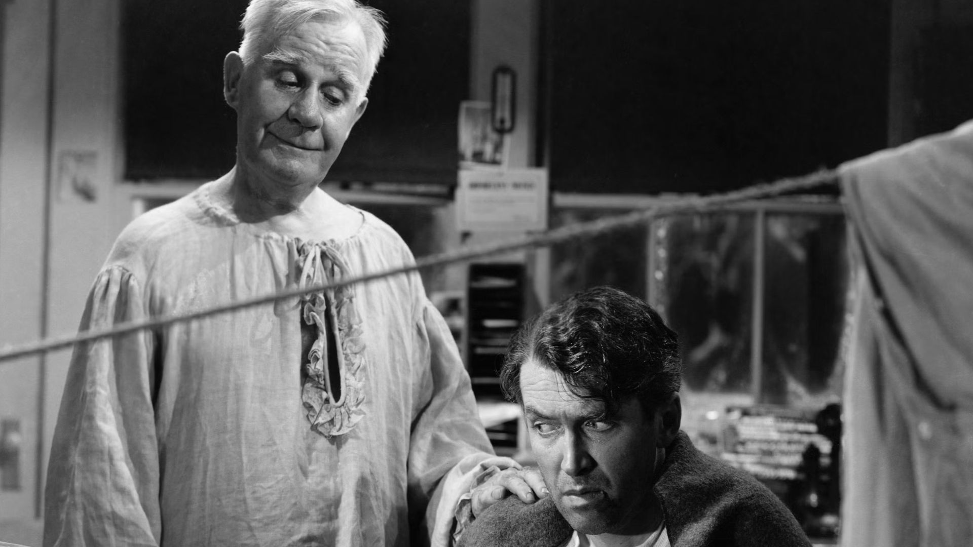 Publicity photo for the film It's a Wonderful Life, featuring James Stewart as George Bailey and Henry Travers as his guardian angel, Clarence Odbody.