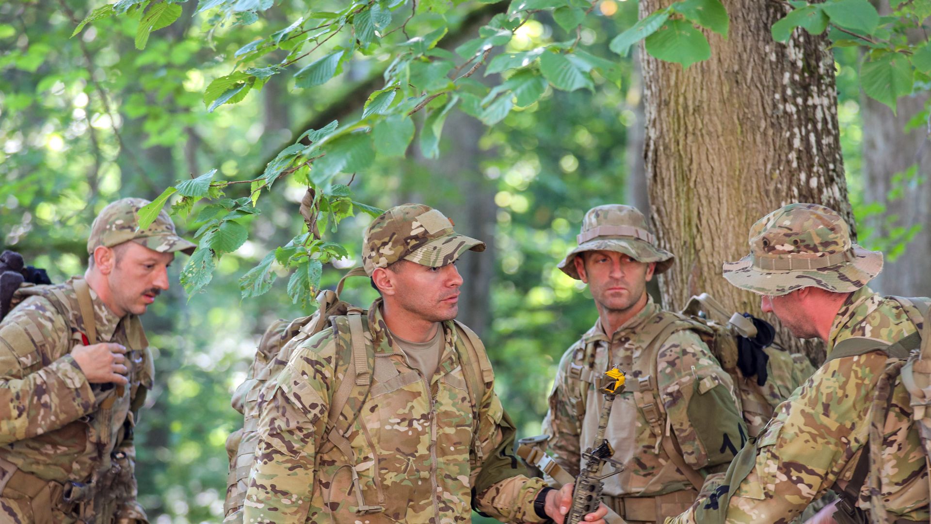 U.S. Army competitors from Headquarters and Headquarters Company, 1st Battalion, 175th Infantry Regiment, Maryland National Guard recover their gear after completing a timed challenge while taking part in the Admiral Pitka Recon Challenge held near Nursip