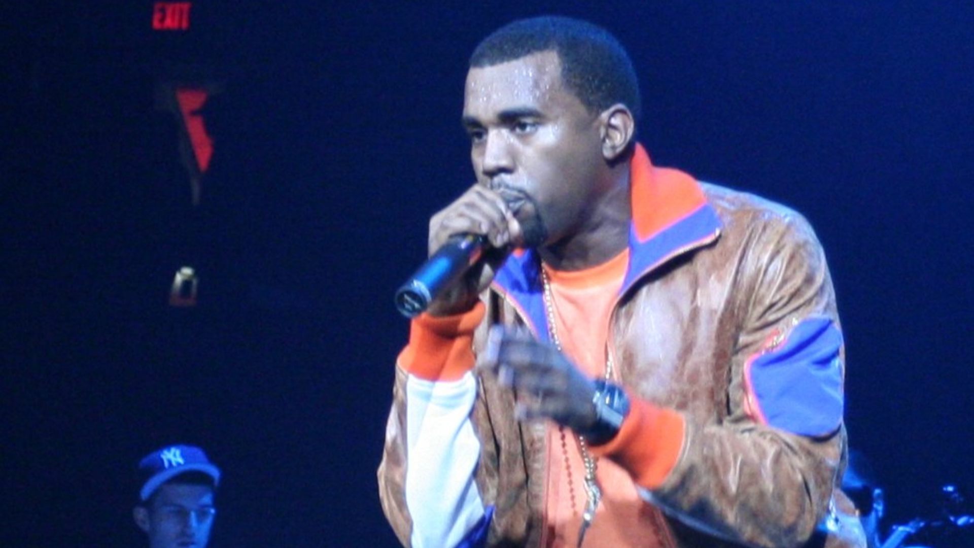 Kanye West performing at a concert on December 19, 2005 in Portland, Oregon, behind him is Canadian DJ A-Trak.