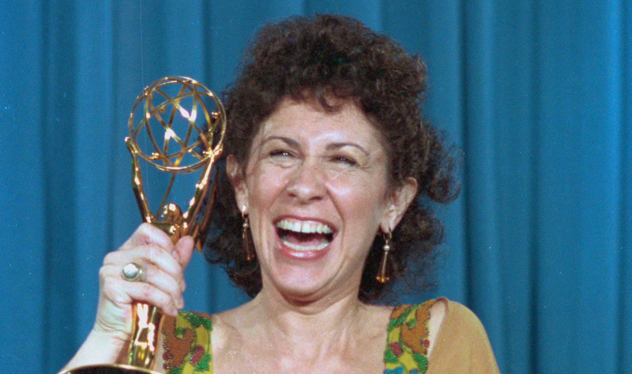 Rhea Perlman of Cheers exults with her Emmy Award, September 23rd, that she won for Outstanding Supporting Actress in a Comedy Series at the 36th Annual Emmy Awards presentations at the Pasadena Civic Auditorium.