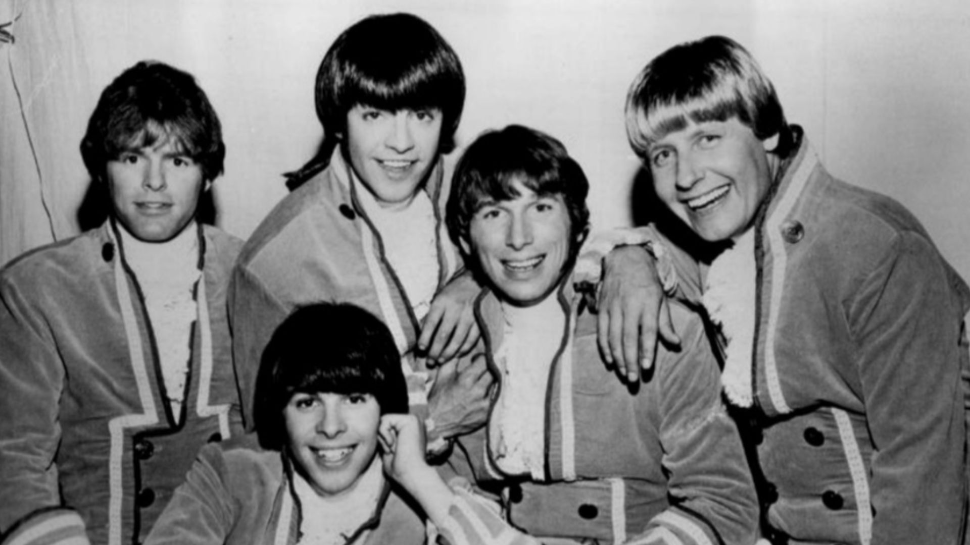 Photo of Paul Revere and the Raiders. Standing from left: Mike
