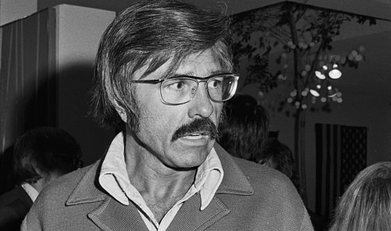 American disc jockey, radio announcer and voice actor Gary Owens, wearing a double-breasted button-front jacket, at a party, United States, 1st July 1974. The party was celebrating the release of Claudine Longet's new single, 'Who Broke Your Heart And Made You Write That Song'. 