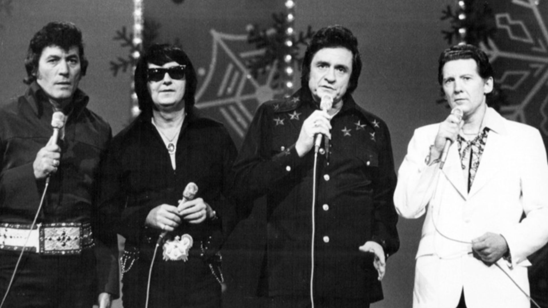 Photo of (from left) Carl Perkins, Roy Orbison, Johnny Cash and Jerry Lee Lewis from the 1977 Johnny Cash Christmas Special television program.