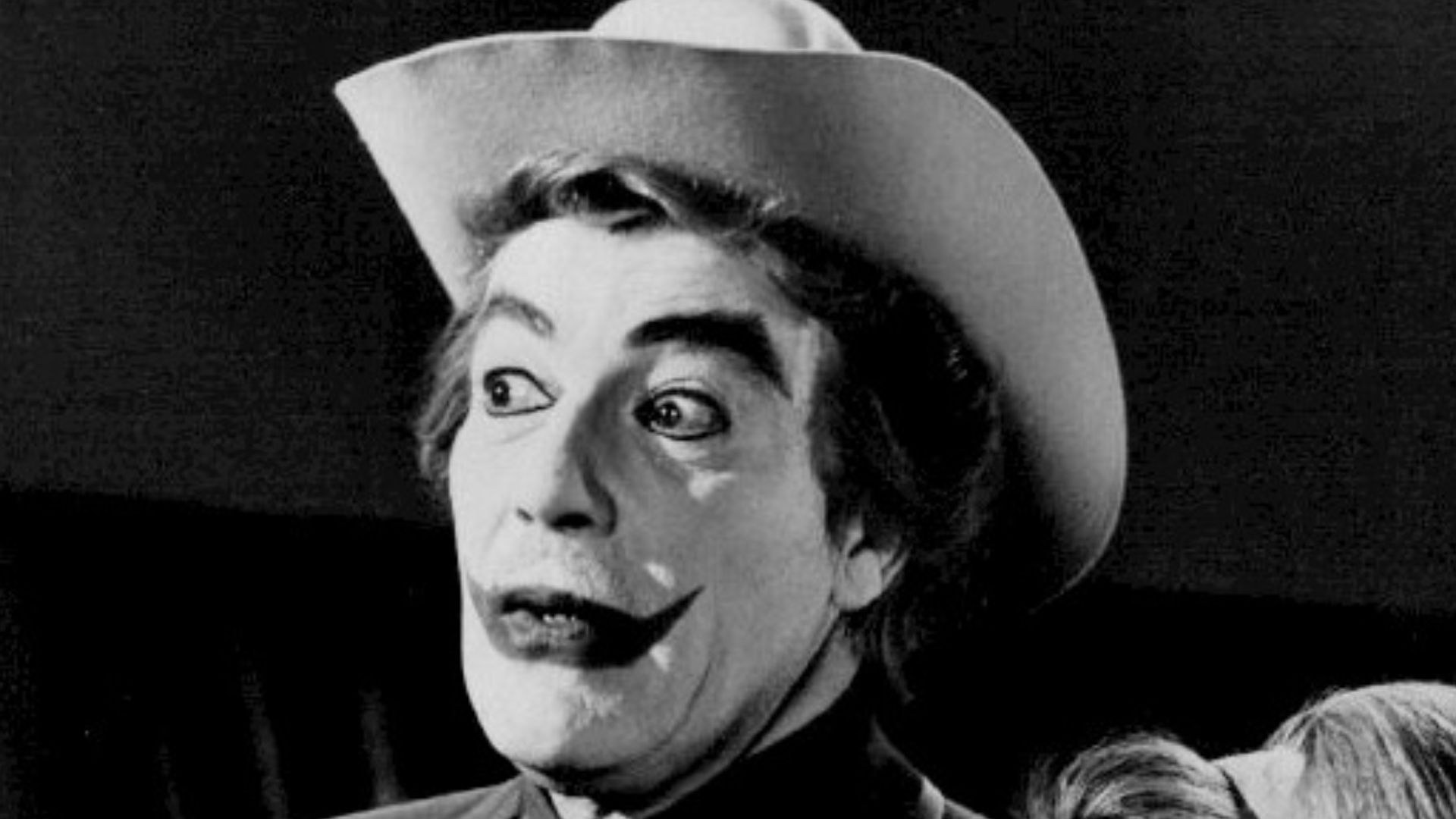 Photo of Cesar Romero as The Joker and Terry Moore as his associate, Venus, from the television program Batman.