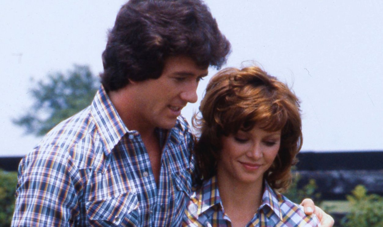 CIRCA 1982: Actor Patrick Duffy and actress Victoria Principa in a quiet moment on the set of the TV show 'Dallas in circa 1982. 
