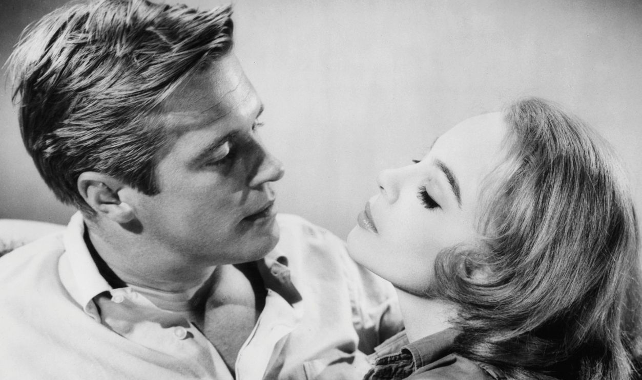 George Peppard and Leslie Caron embrace in a scene from the film 'The Subterraneans', 1960.