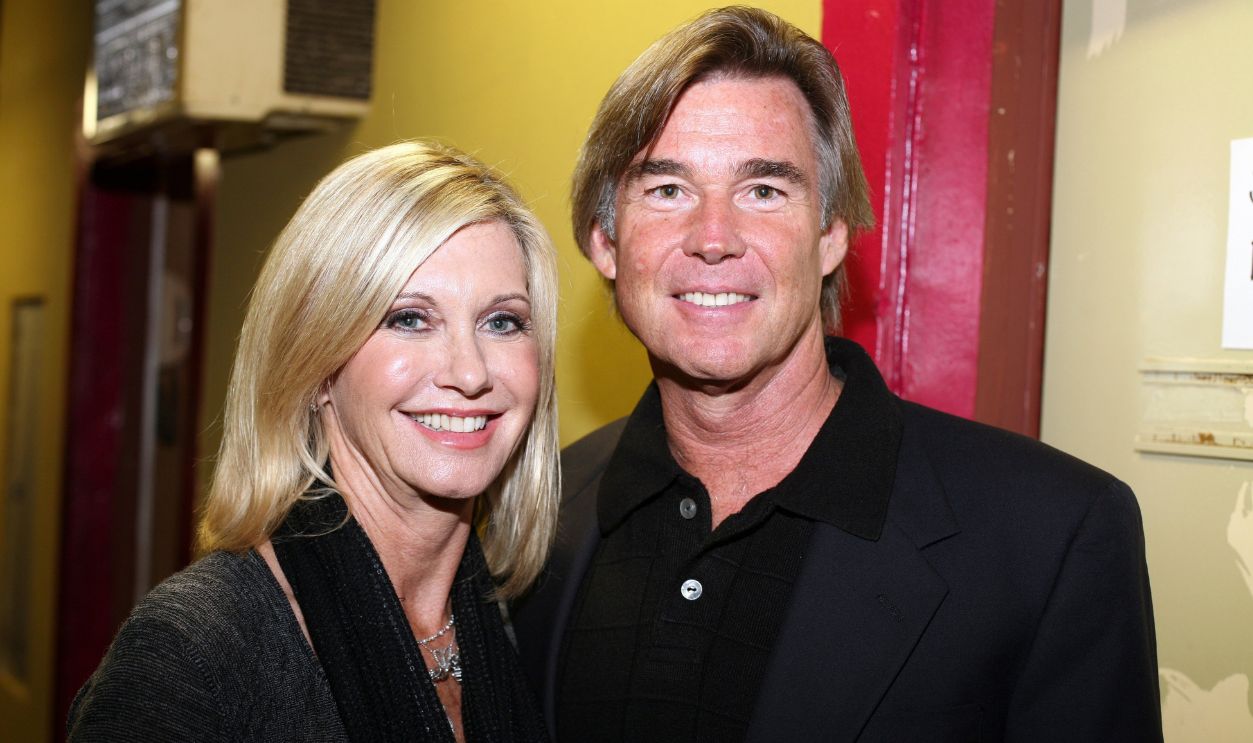 Olivia Newton-John and husband John Easterling pose for a portrait at the Cancer Schmancer Rock Comedy benefit for 'I HEART INC' at the Million Dollar Theater in Los Angeles, California on December 13, 2009