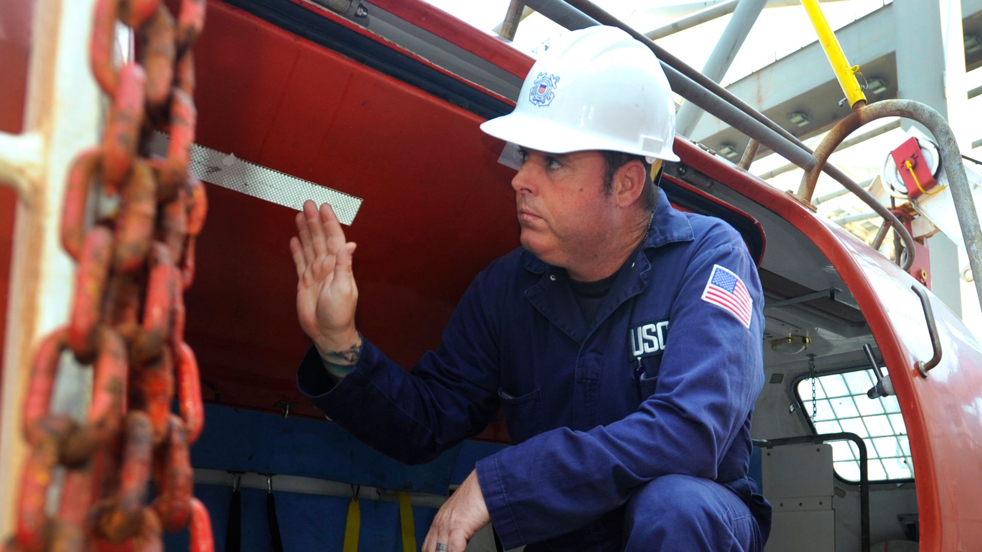 SAN PEDRO, Calif. -- Chief Warrant Officer Joseph Twiddy, an inspector at Coast Guard Sector Los Angeles-Long Beach, inspects the life boat onboard the motor vessel Texas Aug. 2, 2012 in the Port of Los Angeles. The inspection is part of a port state cont