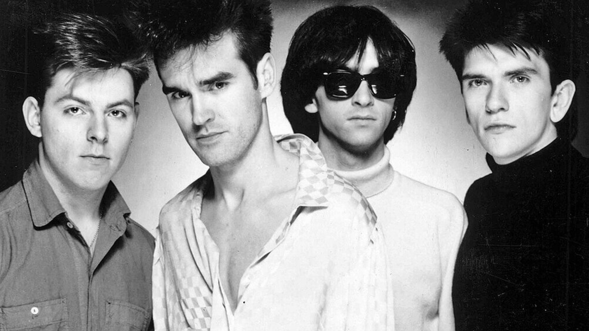 The Smiths in a promotional photograph for their debut album The Smiths, circa 1984. From left to right; Andy Rourke, Morrissey, Johnny Marr, and Mike Joyce. This photo was also issued later to promote their 1985 album Meat Is Murder.