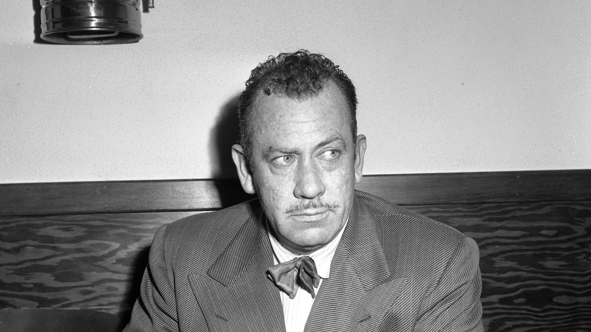 John Steinbeck, seated portrait in a room