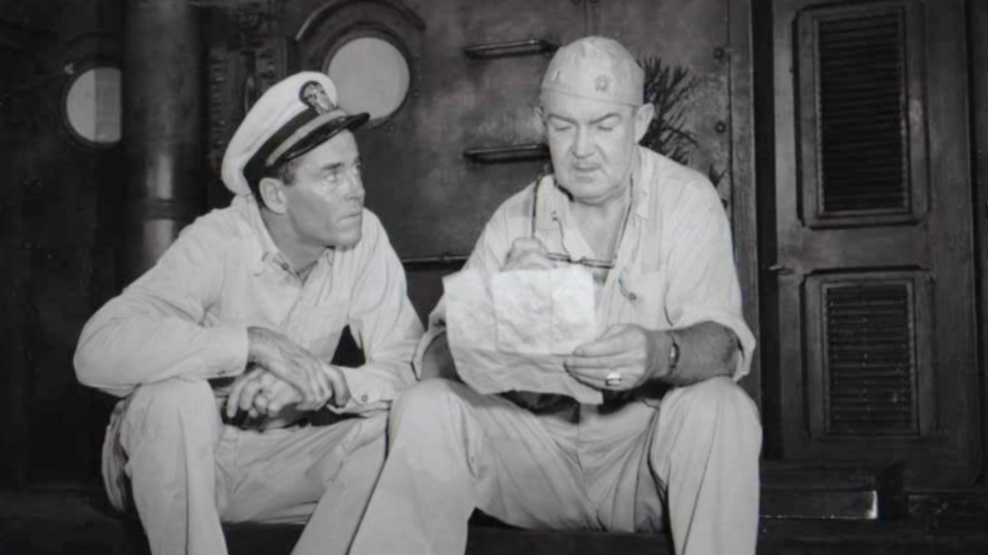 Photo of Henry Fonda as Mister Roberts and Robert Burton as Doc from the Broadway production of Mister Roberts. The item has no copyright markings on it as can be seen in the links above.