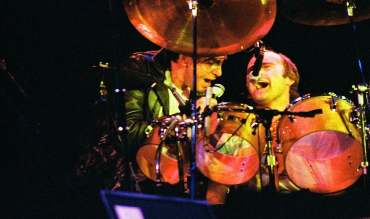 MILTON KEYNES, ENGLAND - OCTOBER 2: Peter Gabriel and Phil Collins on stage performing with Genesis at the reunion concert 'Six of the Best' at The National Bowl on October 2nd, 1982 in Milton Keynes, United Kingdom.