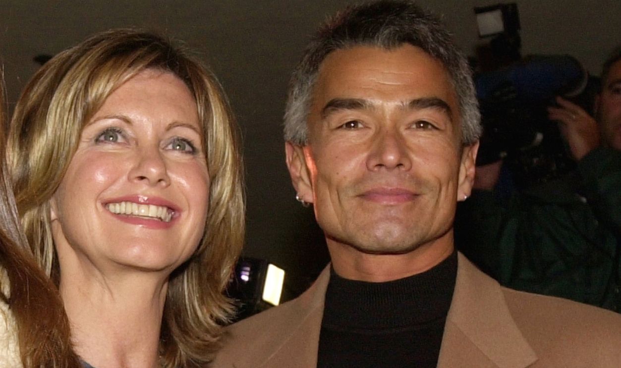 Actress Olivia Newton John, center, daughter Chloe, left, and boyfriend Patrick McDermott, right, arrive at the Los Angeles opening of