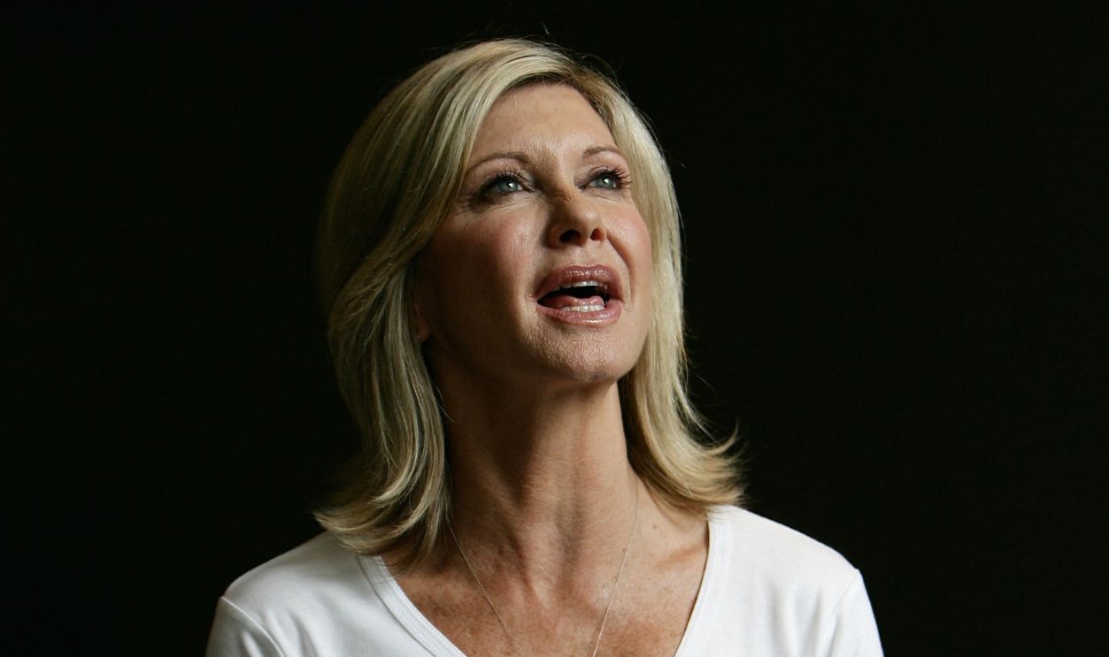 Olivia Newton John poses for the camera just after she announces the team that will join her on a 21 day walking trek through China for the Great Walk to Beijing charity appeal at the Hilton Hotel on February 19, 2008 in Sydney, Australia
