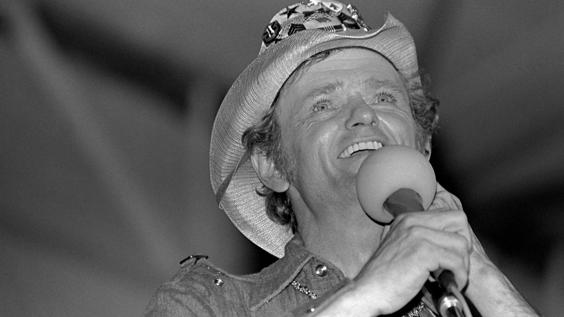 Television, screen and music star, Jerry Reed performs at a concert in Pitt's Memorial Gymnasium or at Rhein-Main Air Base, Germany.