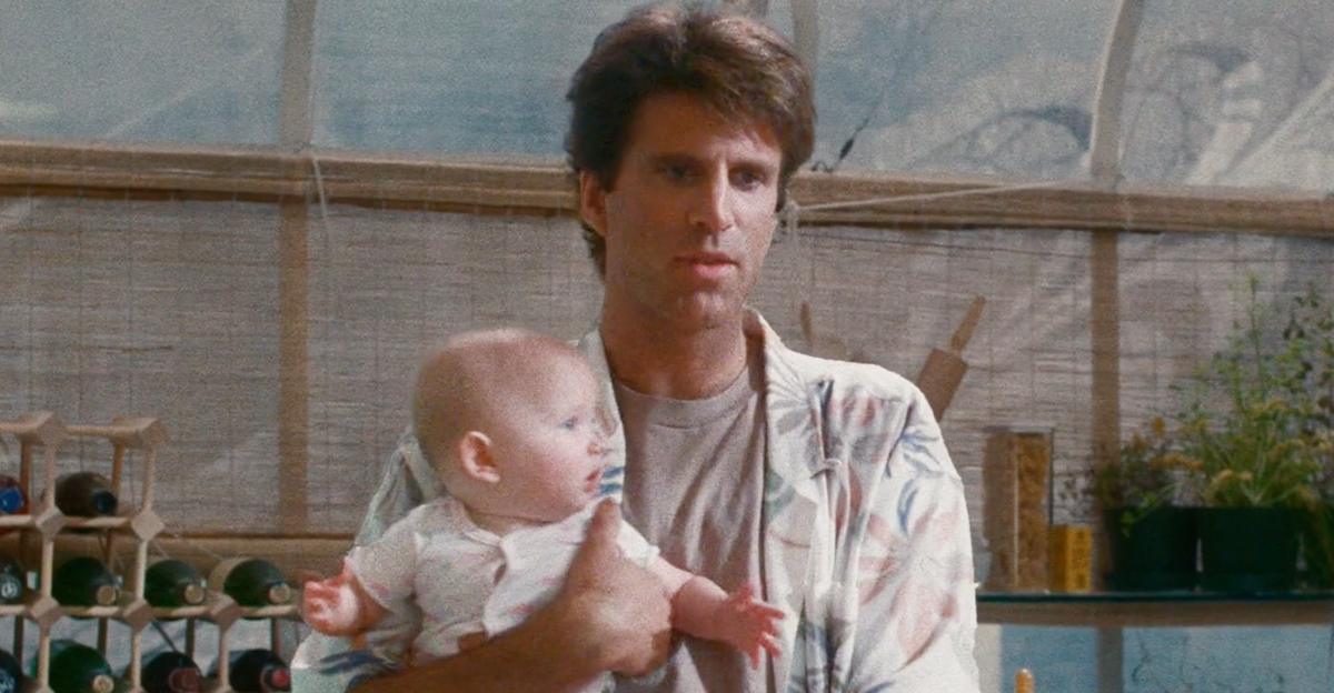 Ted Danson holding the baby in Three Men and a Baby (1987)