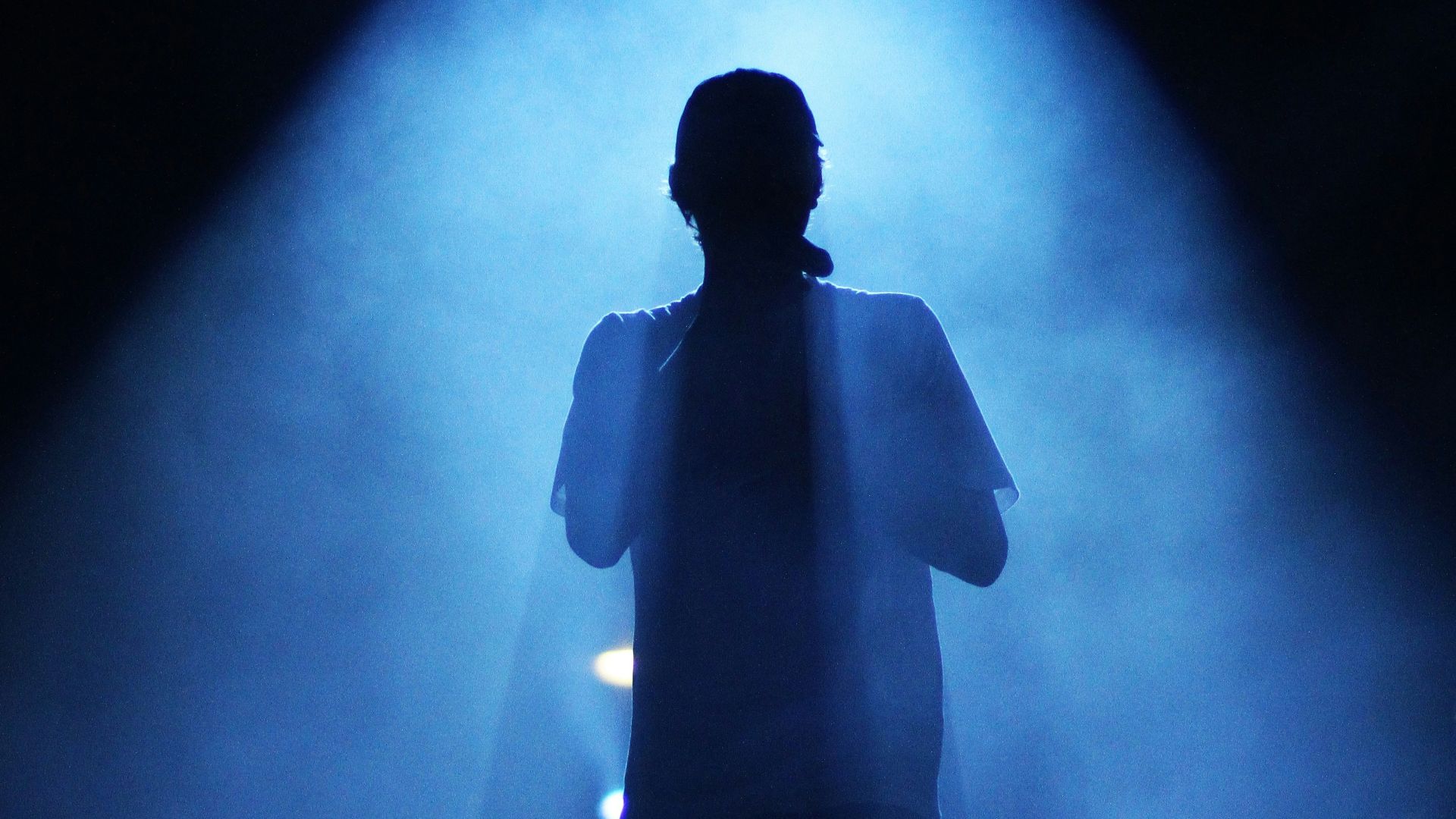 silhouette of man holding camera