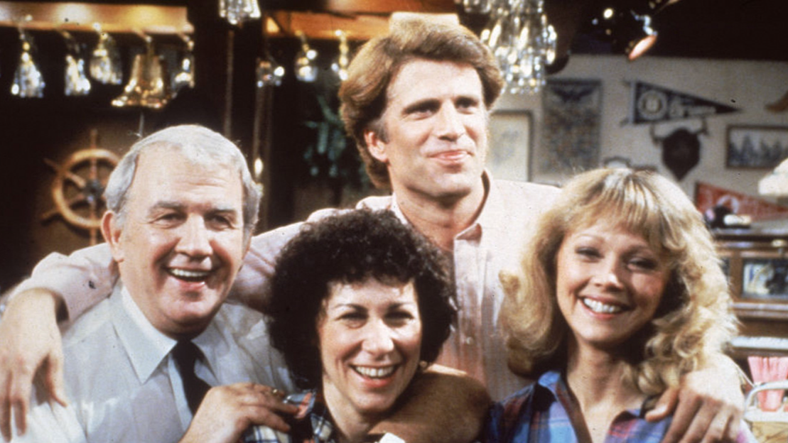 Portrait of actors from the TV series, 'Cheers,' on the barroom set, 1983. L-R: Nicholas Colasanto (1924 - 1985), Rhea Perlman, Ted Danson and Shelley Long.