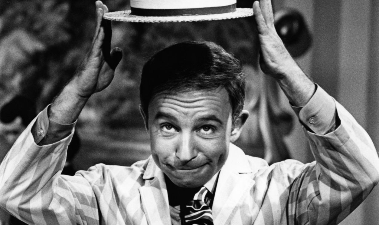 LOS ANGELES - CIRCA 1969: Actor Henry Gibson performs on the NBC television comedy series Rowan and Martin's Laugh-In circa 1969 in Los Angeles, California.