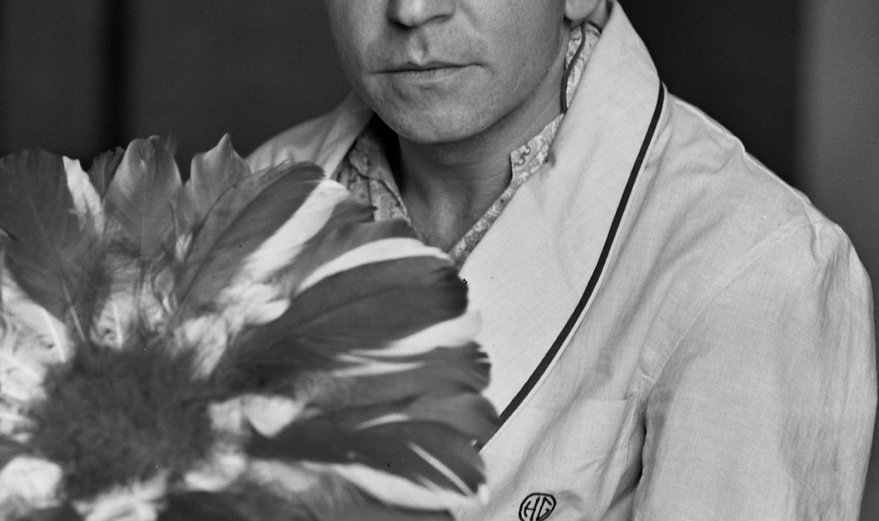 American actor and songwriter Henry Gibson of the TV comedy show 'Rowan and Martin's Laugh In' in his hotel room, London, 1969. 