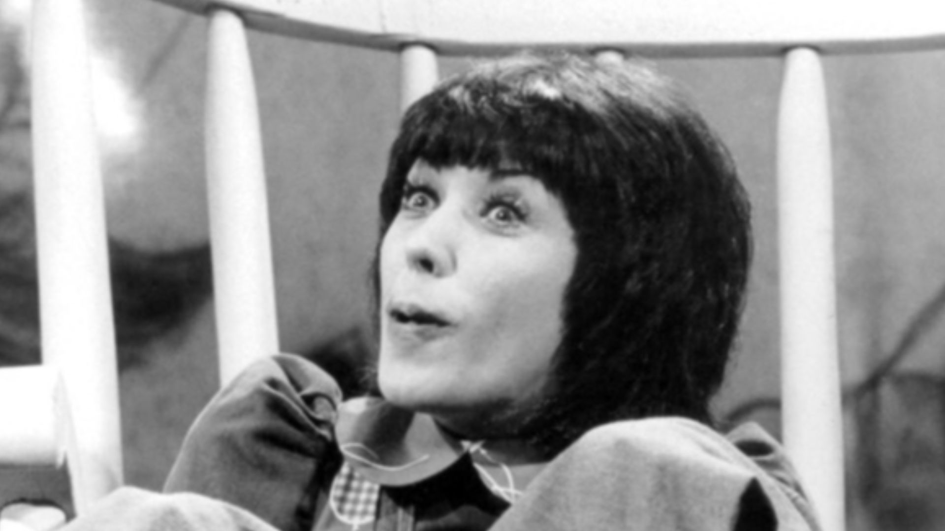 Publicity photo of Lily Tomlin as the character Edith Ann from The Lily Tomlin Show television special.