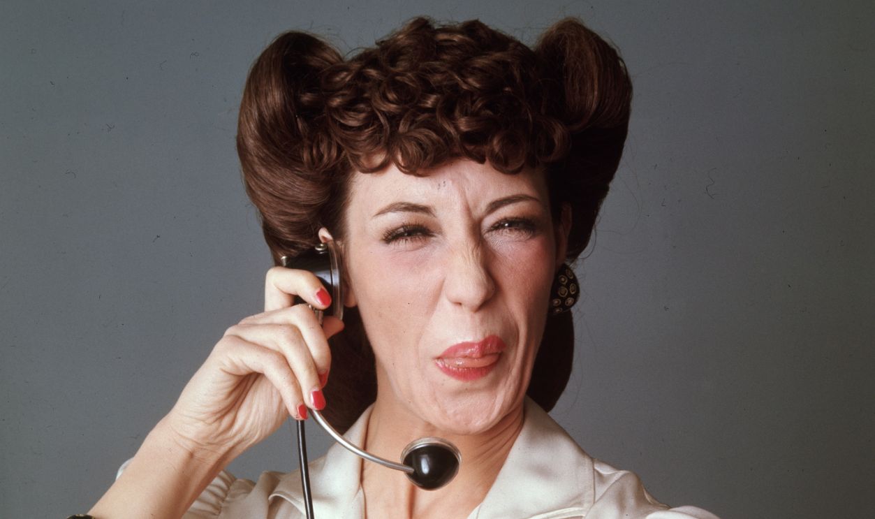 Studio portrait of American comedian and actor Lily Tomlin in costume as a switchboard operator from the television series, 'Laugh-In'.