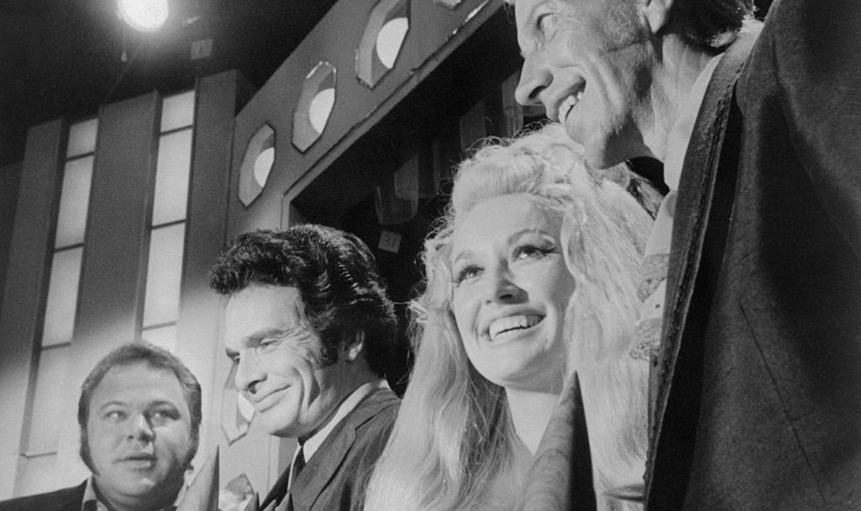 (Original Caption) Award winners, left to right, Roy Clark, Merle Haggard, Dolly Parton, and Porter Wagoner are shown here at the Country Music Association annual awards show.