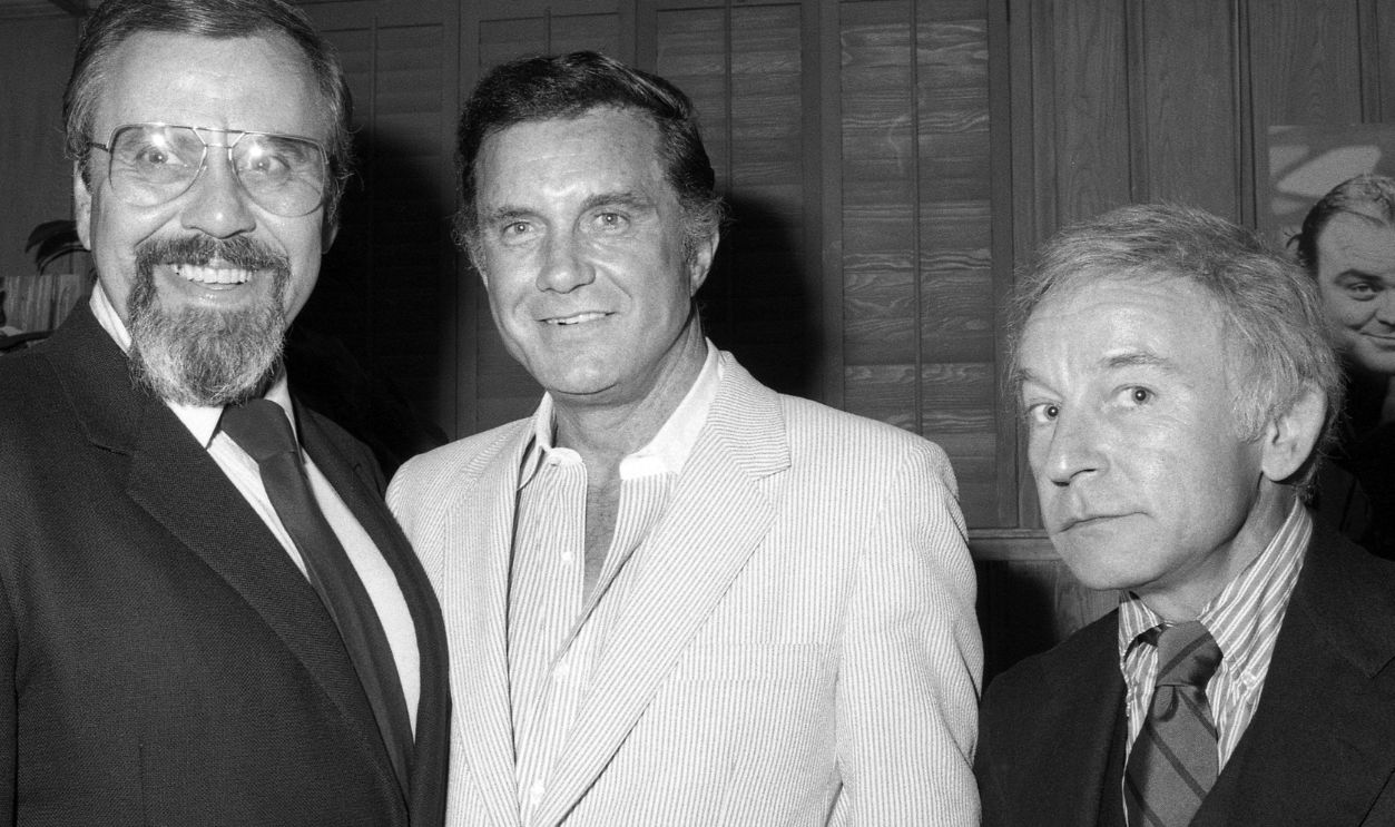 LOS ANGELES - 1983: (L to R) Television producer George Schlatter with actor Cliff Robertson and actor Henry Gibson at Rowan & Martin's Laugh In cast reunion in 1983 in Los Angeles, Califfornia.