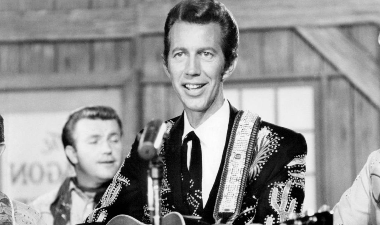 American country music singer Porter Wagoner (1927 - 2007) performing, circa 1960.