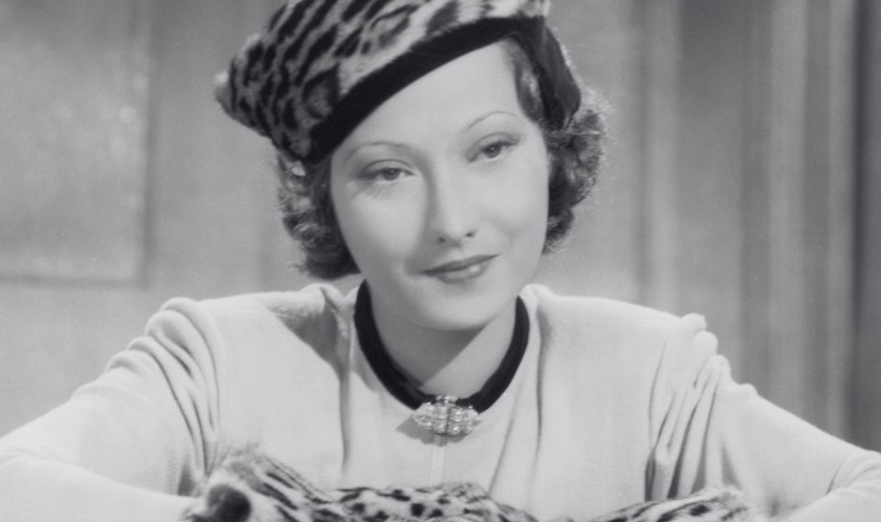 Actress Merle Oberon (1911 - 1979) wearing a leopardskin hat